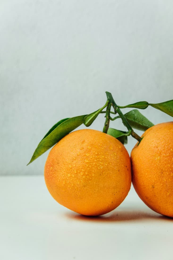 Fresh oranges with leaves