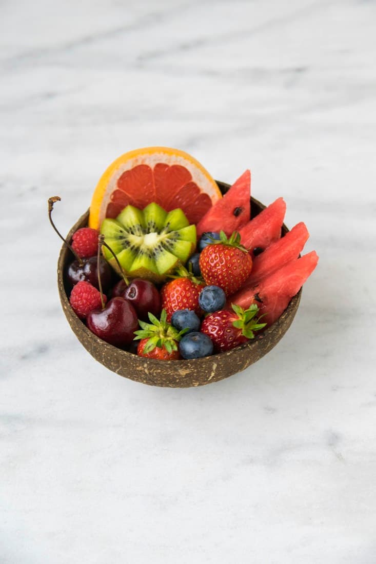 A beautifully arranged bowl of mixed fresh fruit
